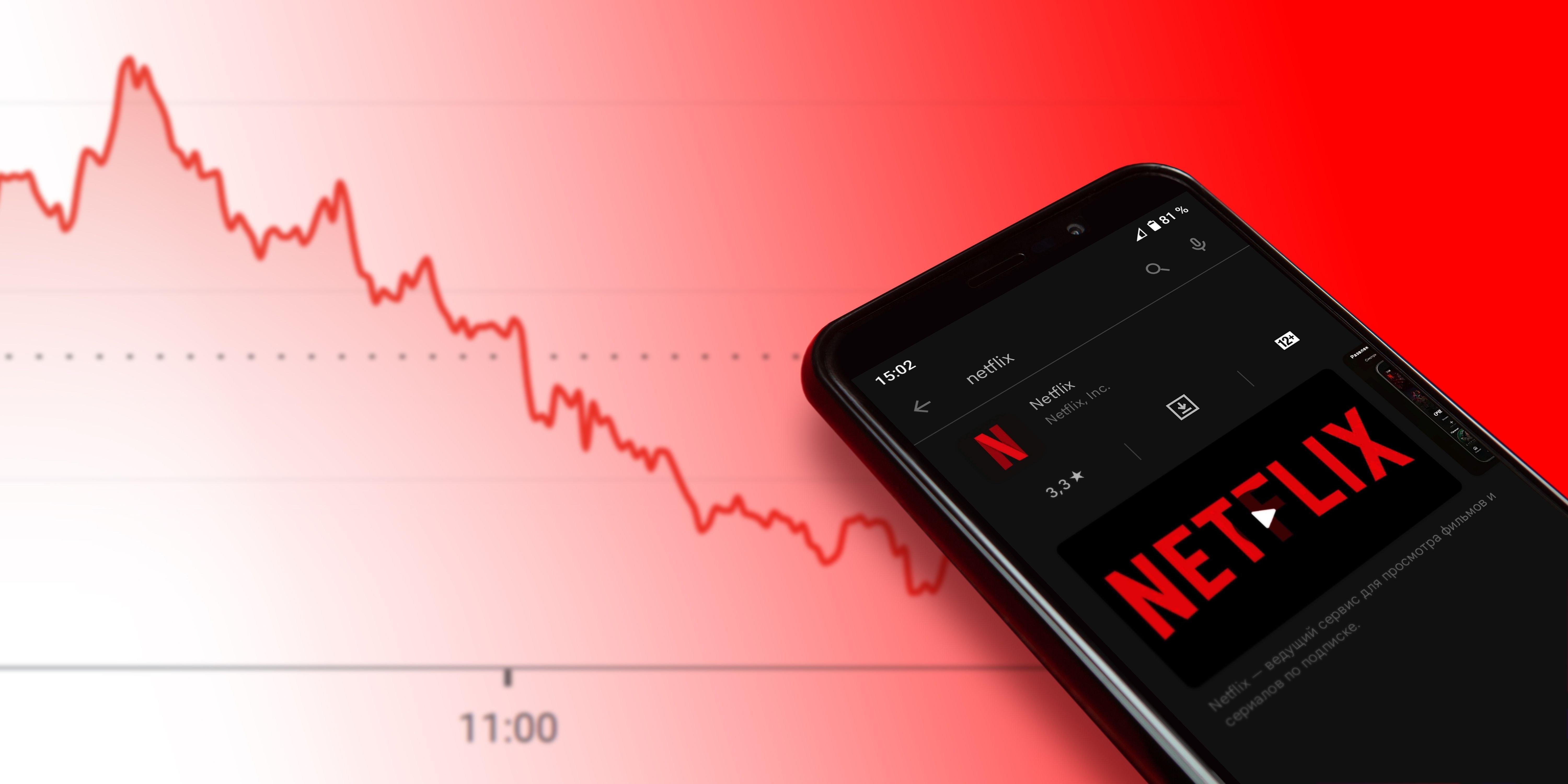 Netflix logo on a phone and a Red Graph