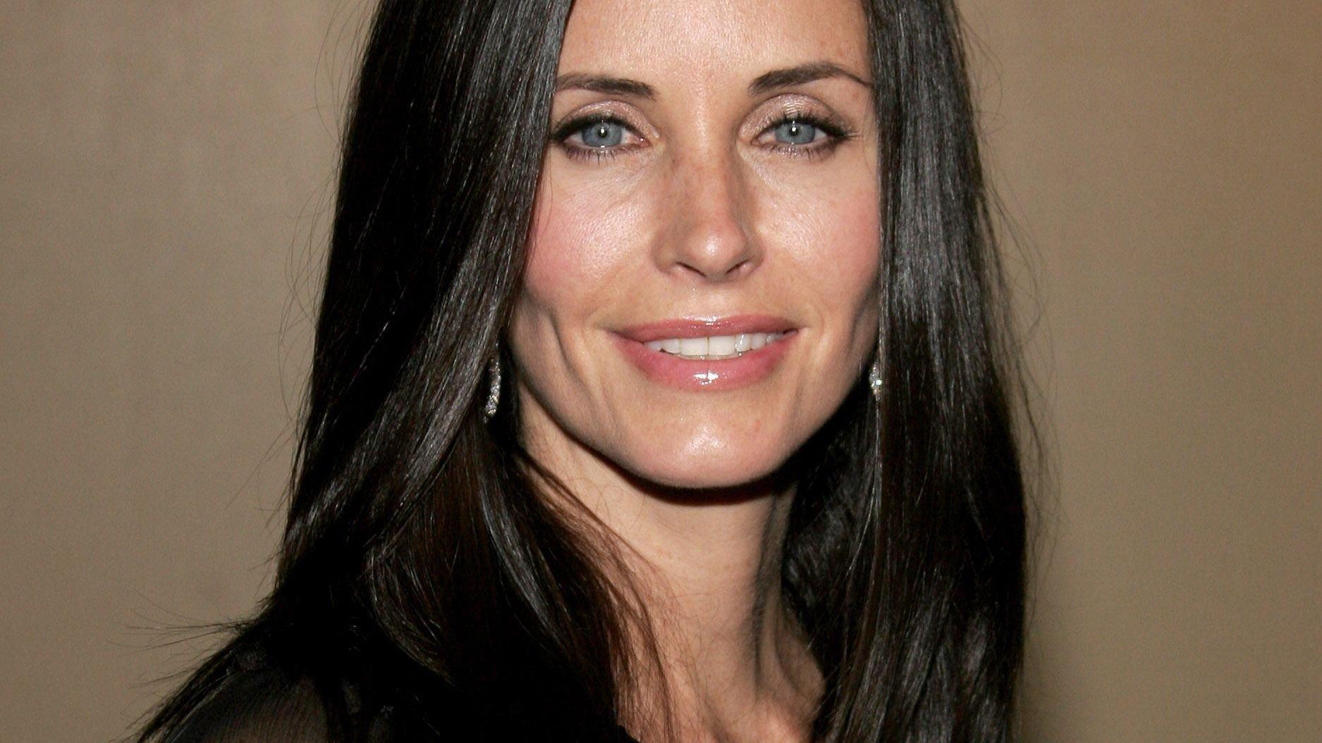 Closeup of Courteney Cox with long straight hair