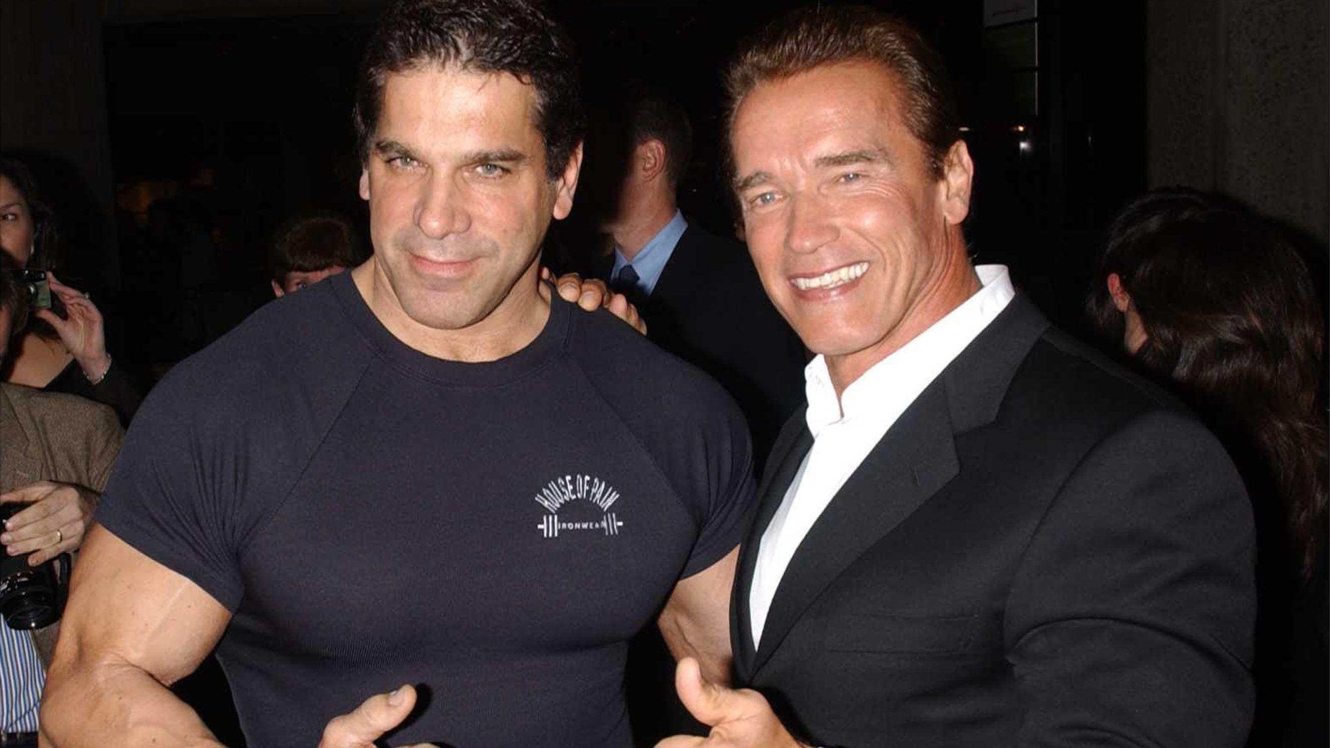 Arnold Schwarzenegger and Lou Ferrigno posing for the camera at Pumping Iron's 25th Anniversary