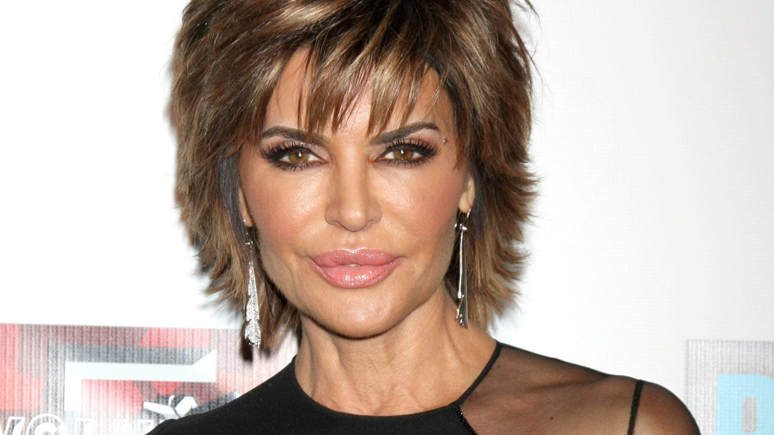 Lisa Rinna with signature hairstyle and dangling earrings