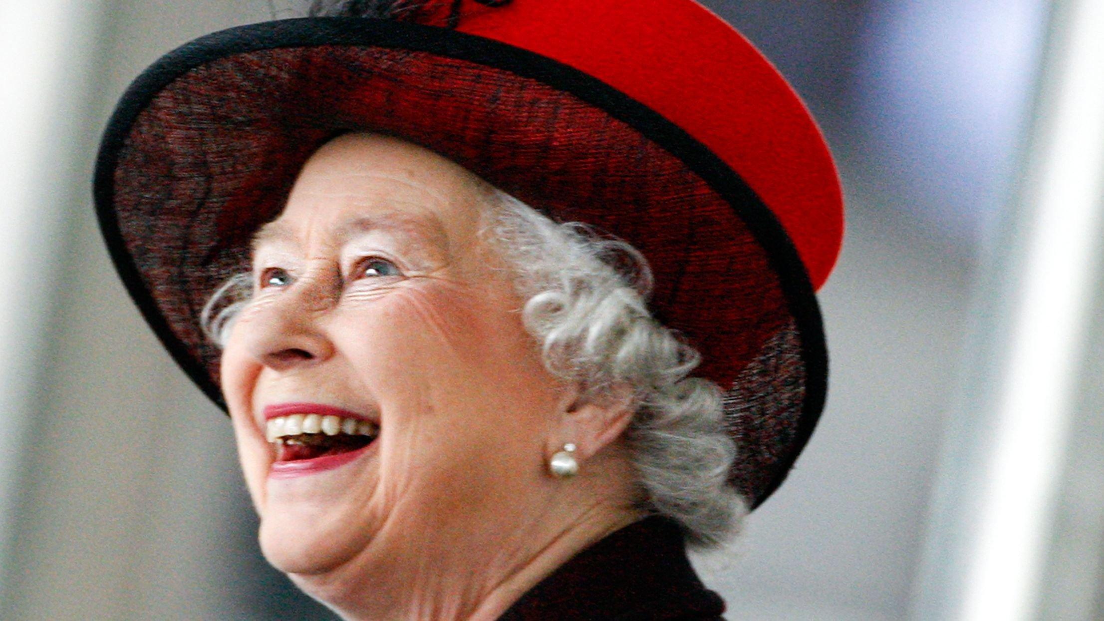 Queen Elizabeth II looks on