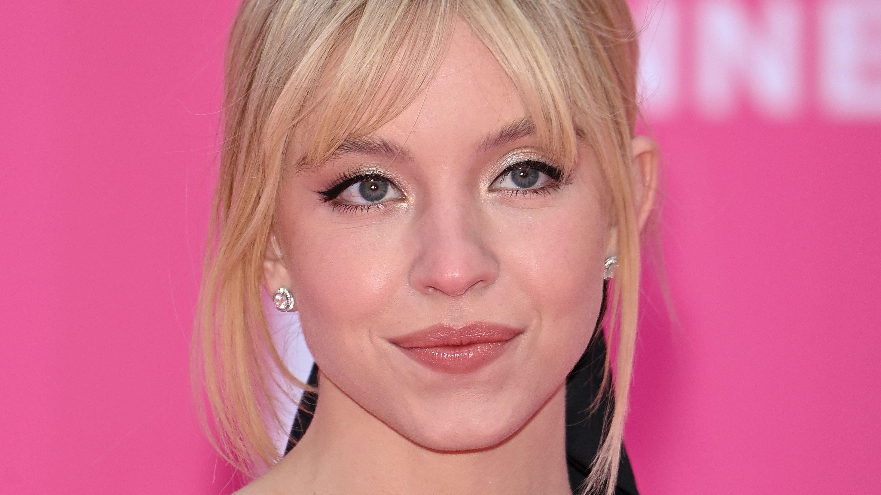 Sydney Sweeney sporting curtain bangs on a red carpet event.