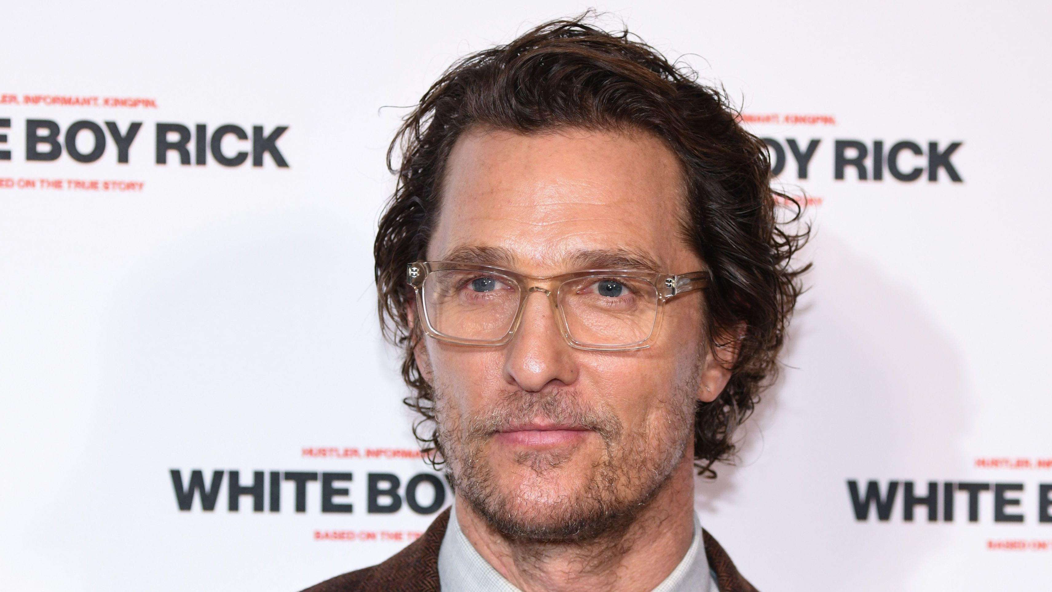 Matthew McConaughey in brown suit and glasses