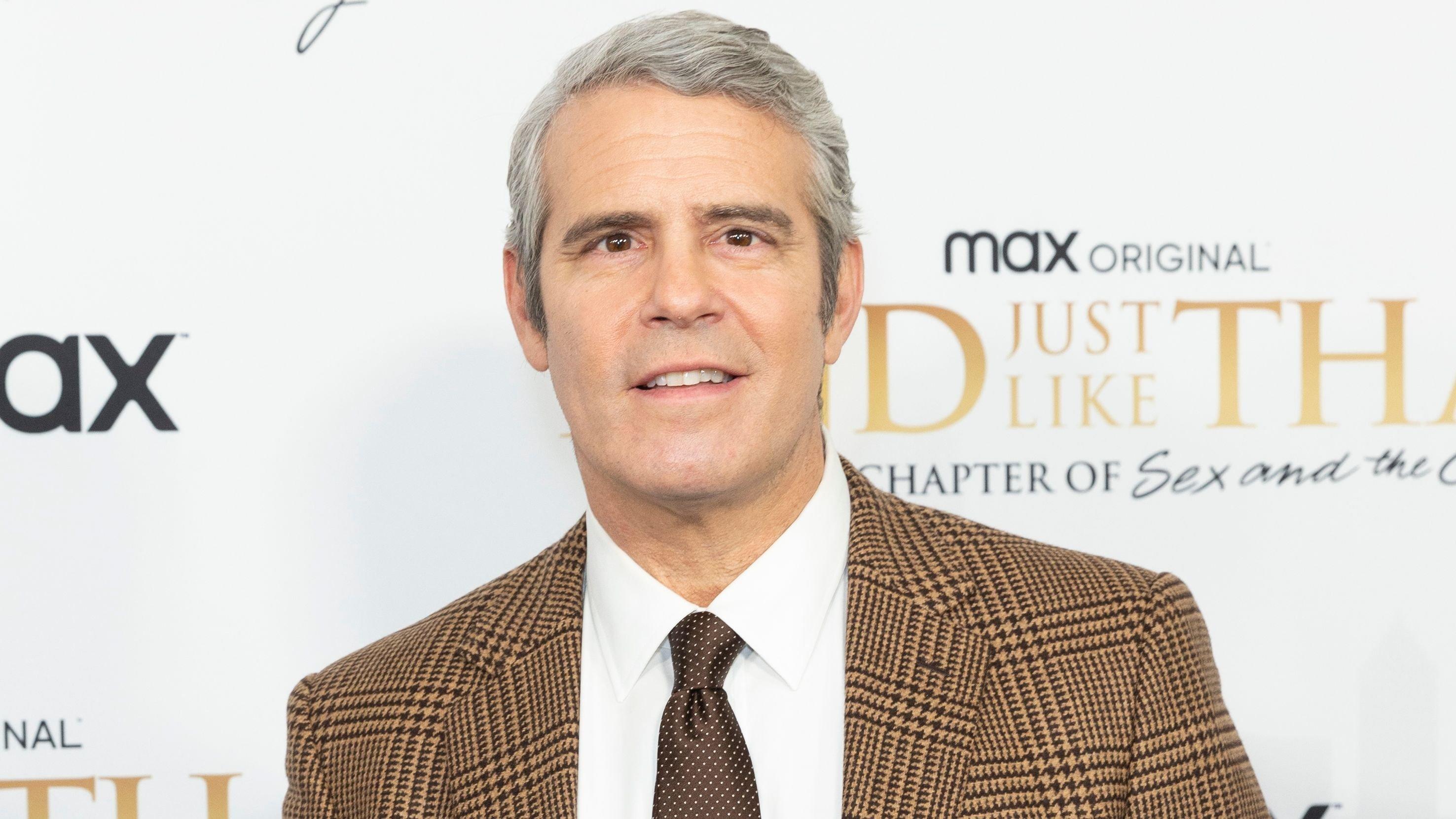 Andy Cohen in brown suit and tie